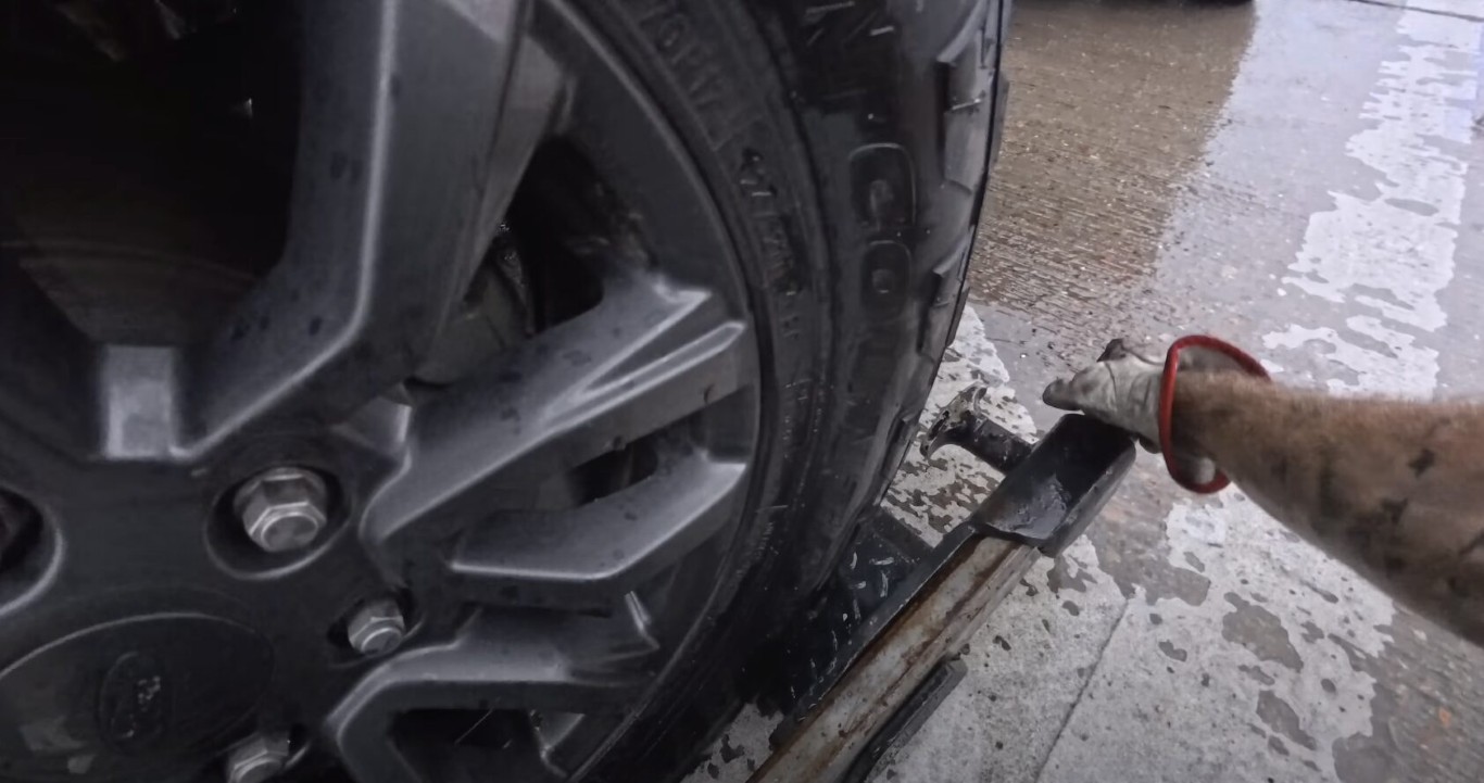 Close-up of tire assistance and roadside repair in Herriman